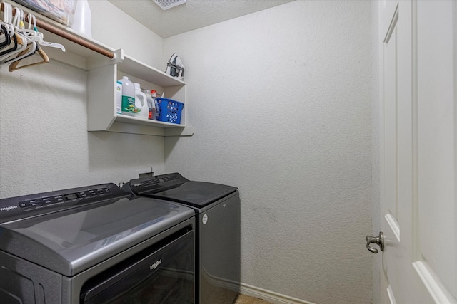 laundry area with washer and dryer