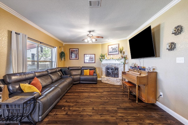 living room featuring a textured ceiling, ceiling fan, crown molding, and dark wood-type flooring