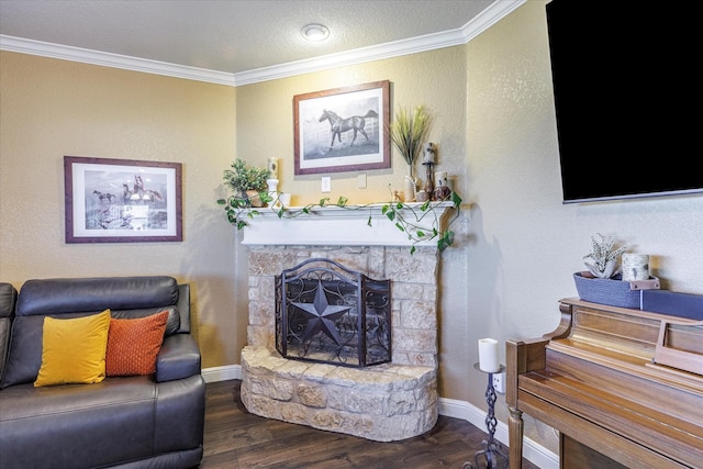 living room featuring a fireplace, dark wood-type flooring, ornamental molding, and a textured ceiling