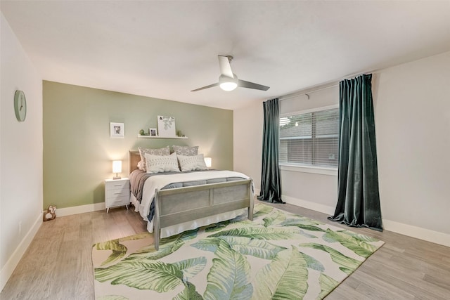 bedroom featuring ceiling fan and light hardwood / wood-style floors