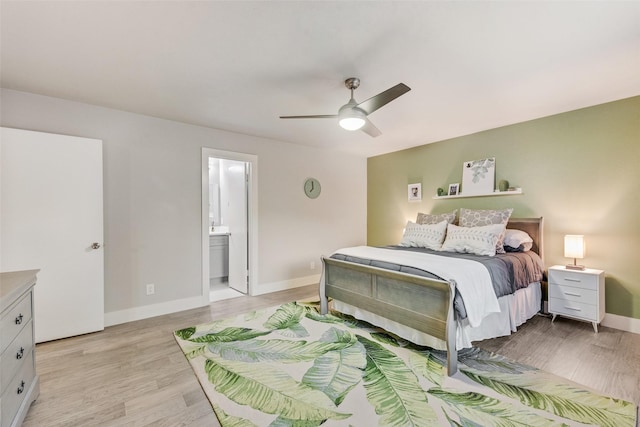 bedroom featuring ensuite bathroom, ceiling fan, and light hardwood / wood-style flooring