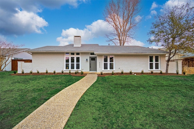 ranch-style house with a front lawn