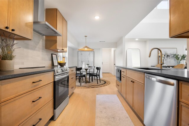 kitchen featuring electric range, light hardwood / wood-style floors, and tasteful backsplash