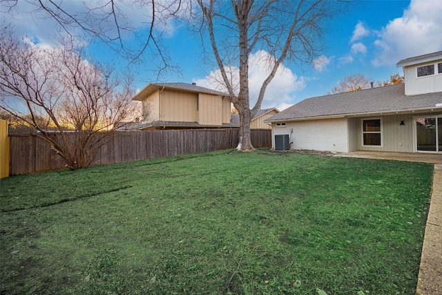 view of yard featuring cooling unit and a patio area