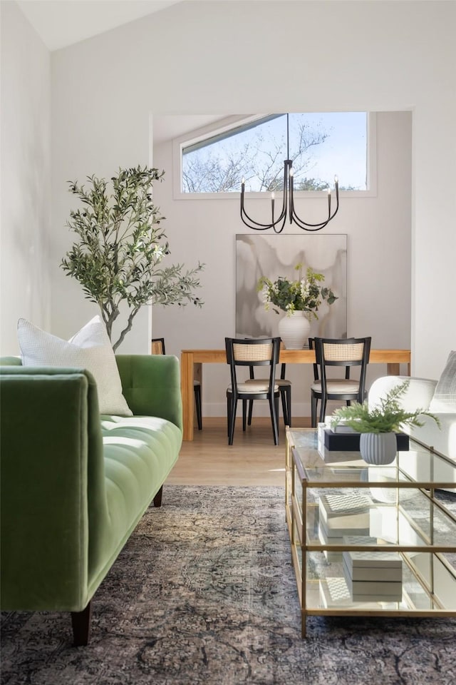 living room with high vaulted ceiling, light hardwood / wood-style floors, a wealth of natural light, and a fireplace