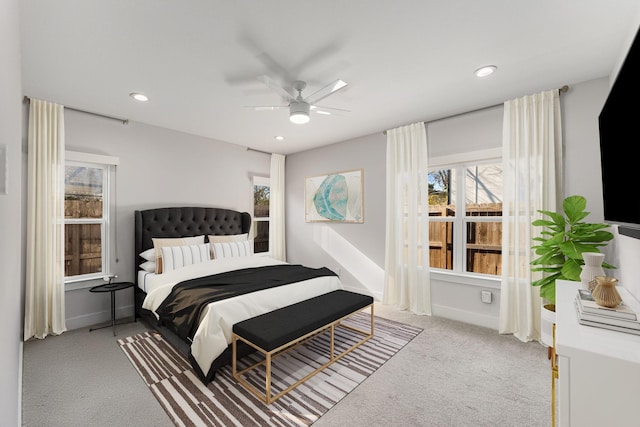 bedroom featuring ceiling fan and light carpet