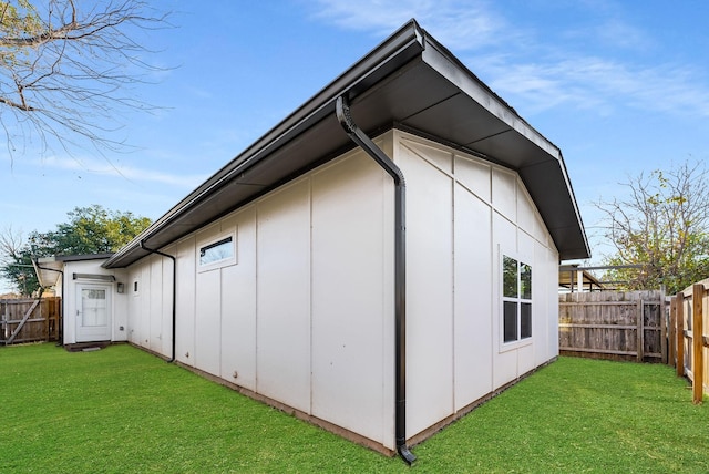 view of property exterior with a lawn