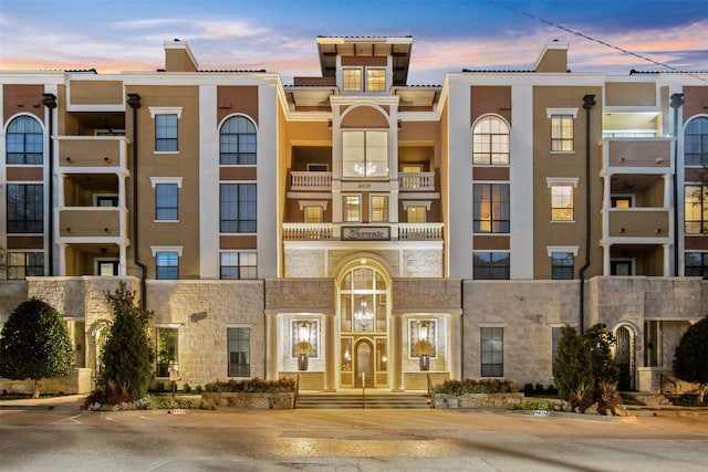 view of outdoor building at dusk