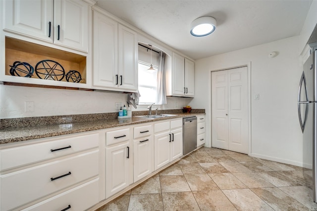 kitchen featuring stainless steel appliances, white cabinets, and sink