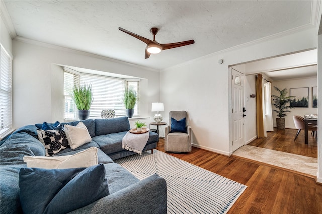 living room featuring plenty of natural light, ceiling fan, and hardwood / wood-style floors