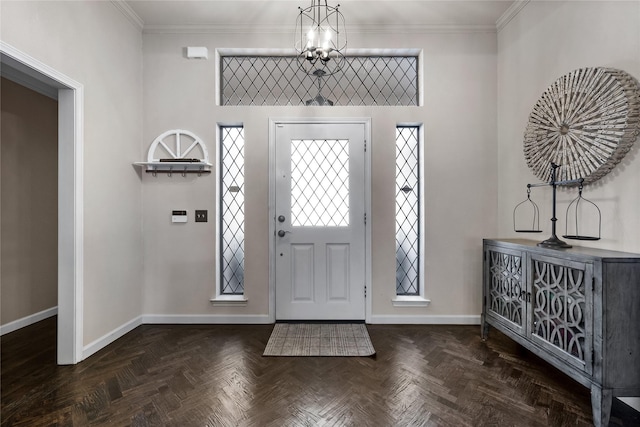 entryway with dark parquet flooring and crown molding