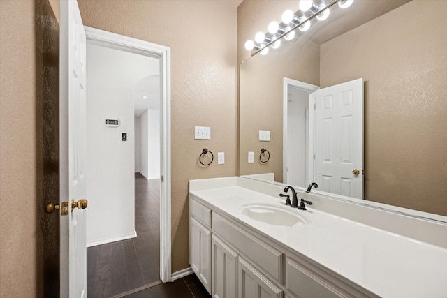 bathroom featuring tile patterned floors and vanity