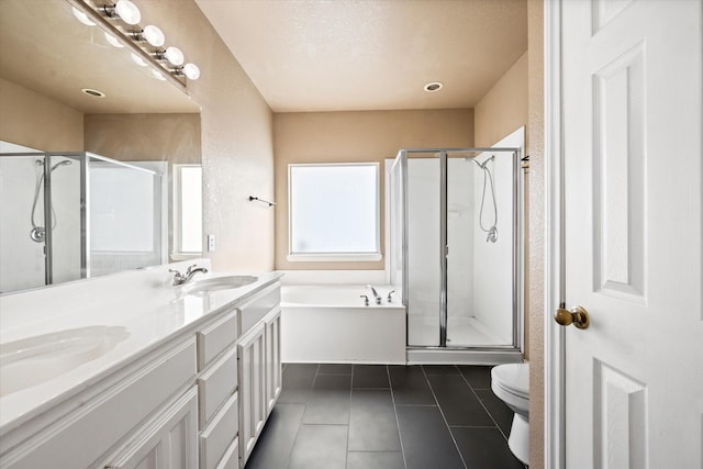 full bathroom featuring toilet, vanity, tile patterned floors, and independent shower and bath