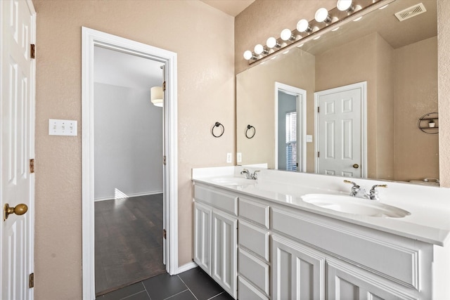 bathroom with vanity and tile patterned flooring