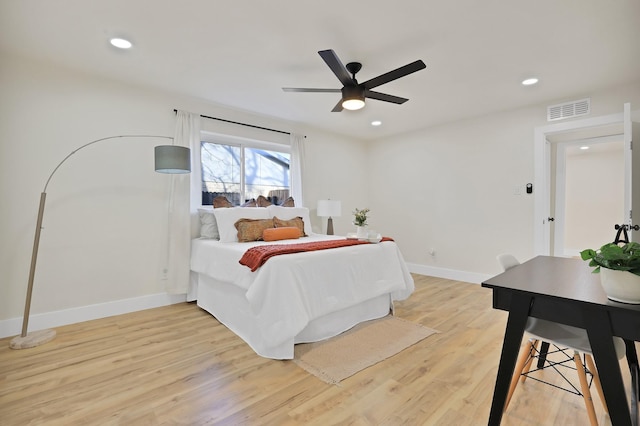 bedroom with ceiling fan and light hardwood / wood-style flooring