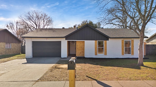 ranch-style home featuring a garage