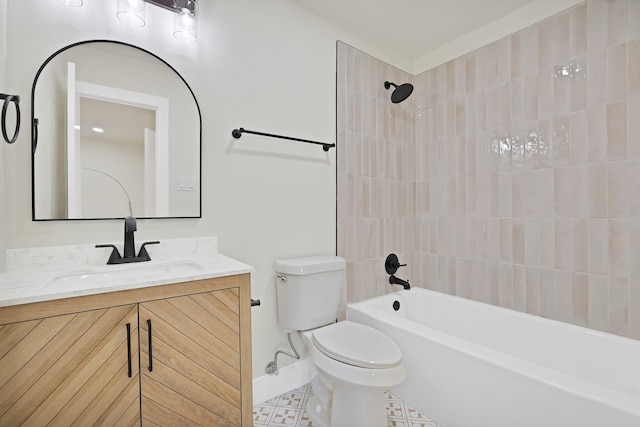 full bathroom with toilet, vanity, and tiled shower / bath combo