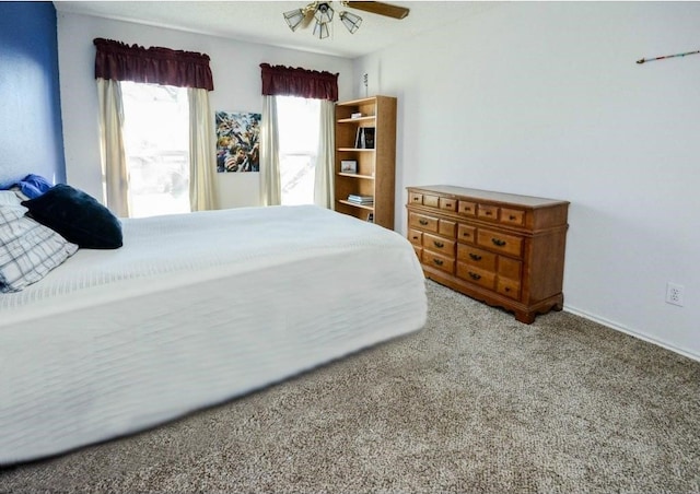 bedroom with ceiling fan and light carpet