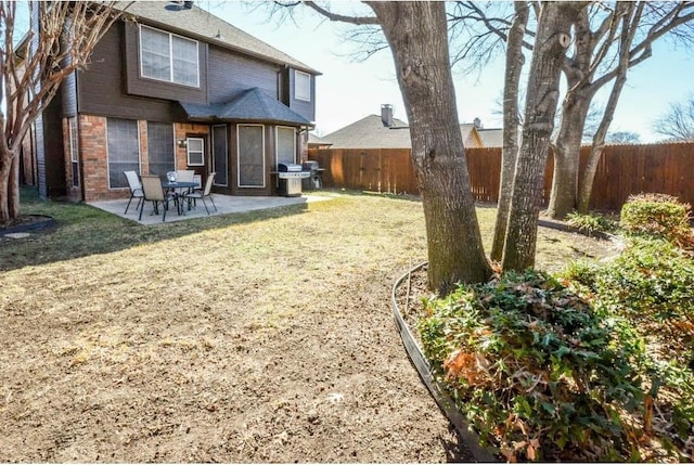 back of property featuring a patio and a lawn