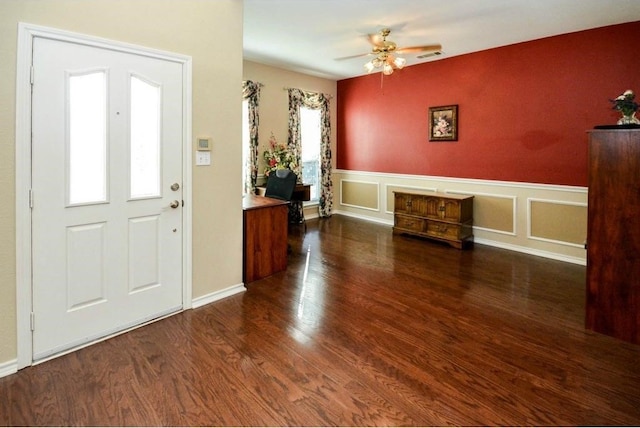 entryway with ceiling fan and dark hardwood / wood-style flooring