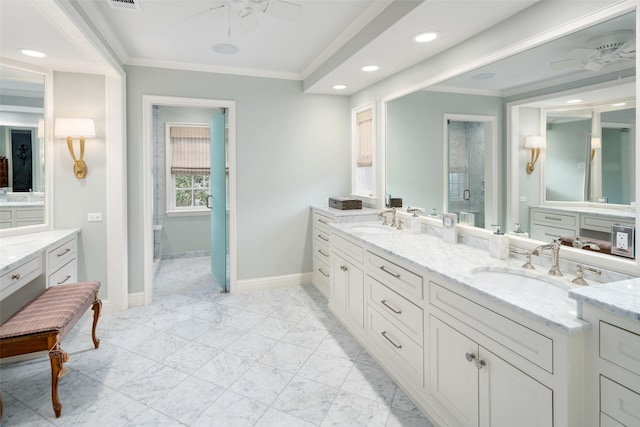 bathroom with a shower with door, vanity, ceiling fan, and crown molding