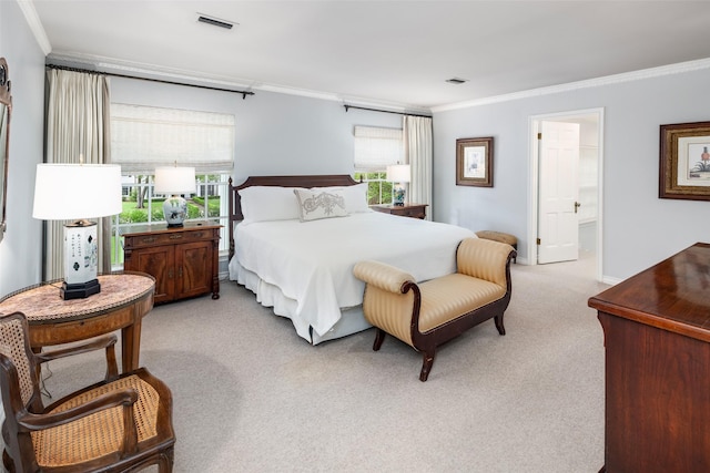 bedroom with multiple windows, connected bathroom, ornamental molding, and light colored carpet