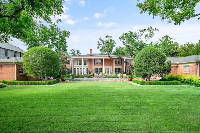 view of front of home with a front yard