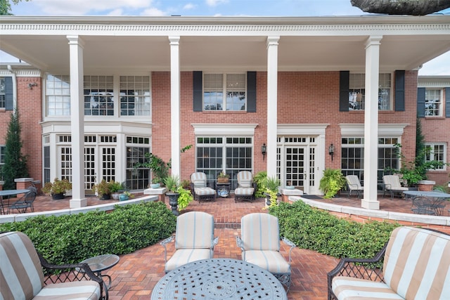 rear view of house with french doors and a patio