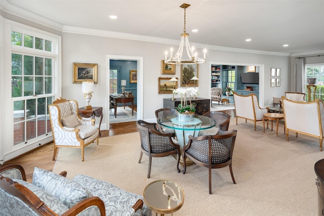 dining space featuring ornamental molding and a chandelier