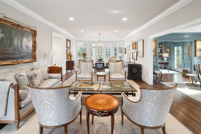 living room featuring french doors, ornamental molding, and hardwood / wood-style flooring