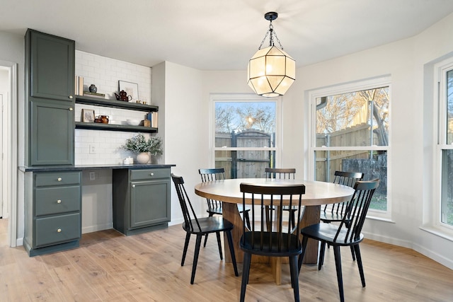 dining area with light hardwood / wood-style floors