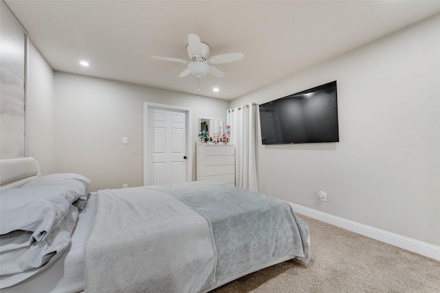 carpeted bedroom with ceiling fan