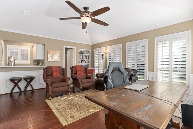 office space featuring crown molding, ceiling fan, dark wood-type flooring, built in features, and lofted ceiling