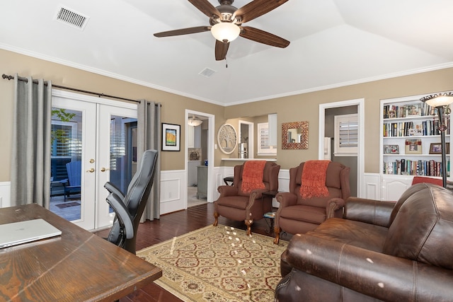 living room with ornamental molding, dark wood-type flooring, french doors, ceiling fan, and built in features