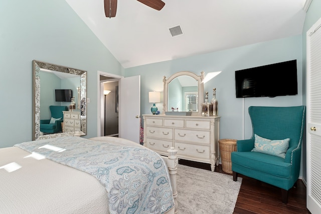 bedroom with ceiling fan, high vaulted ceiling, and dark hardwood / wood-style floors