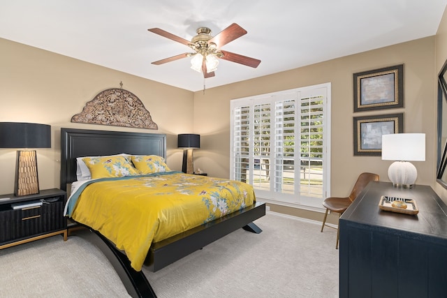 carpeted bedroom featuring ceiling fan