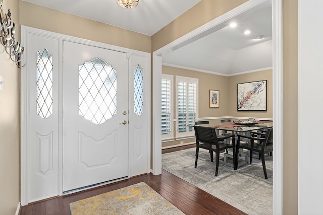 entrance foyer featuring crown molding and dark hardwood / wood-style floors