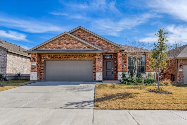 view of front of property with a front yard and a garage