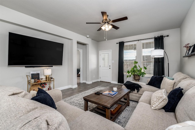 living room featuring light wood-type flooring and ceiling fan