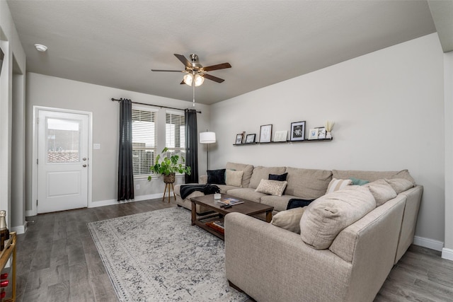 living room with wood-type flooring, a textured ceiling, and ceiling fan