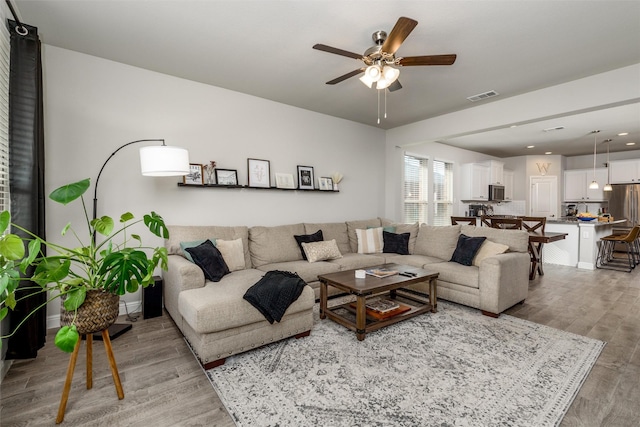 living room with ceiling fan