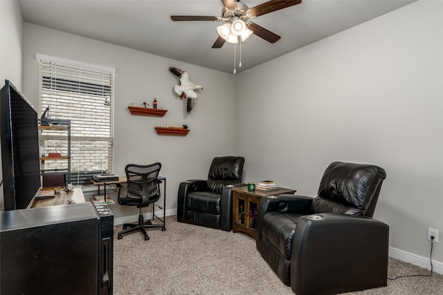 home office with ceiling fan and light carpet