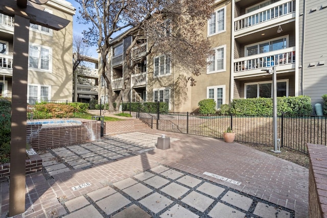 view of home's community with a patio area