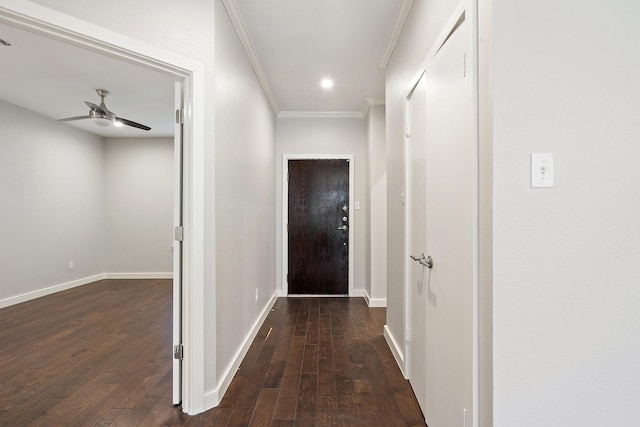 hall featuring ornamental molding and dark hardwood / wood-style floors