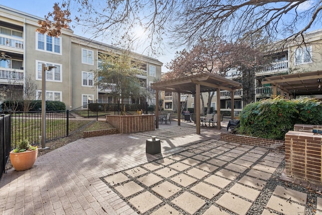 surrounding community featuring a patio area and a pergola