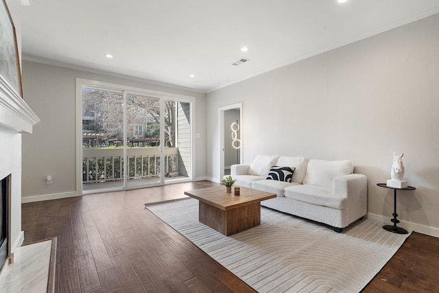 living room with light wood-type flooring and crown molding