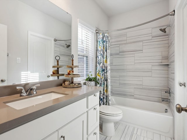 full bathroom with toilet, shower / bathtub combination with curtain, and vanity