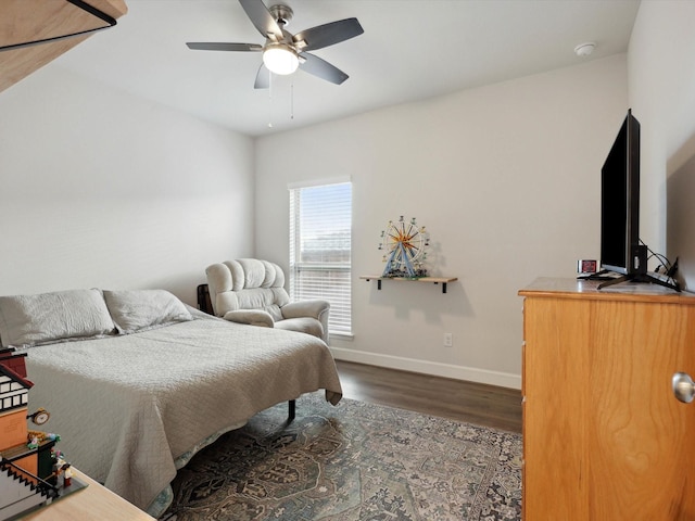 bedroom with ceiling fan and dark wood-type flooring