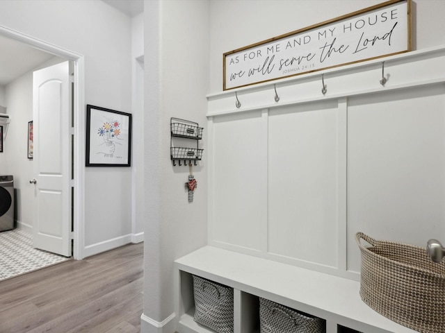 mudroom with washer / clothes dryer and light wood-type flooring