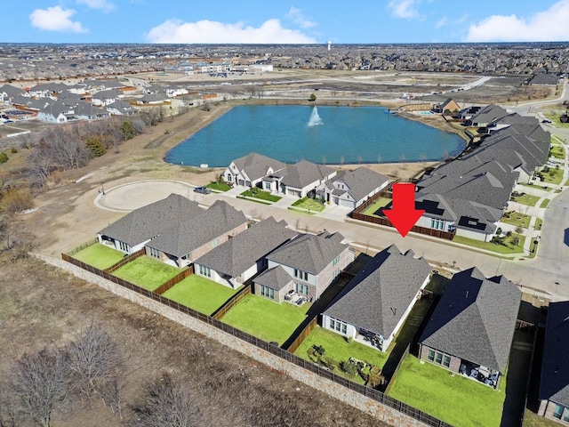 bird's eye view featuring a residential view and a water view